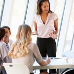 Business People Having Board Meeting In Modern Office