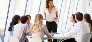 Business People Having Board Meeting In Modern Office